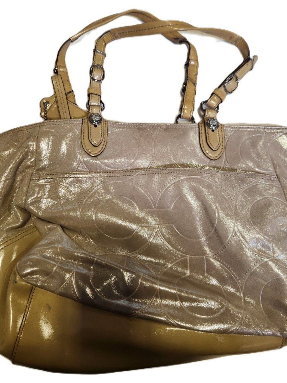 Coach Mia tote bag featuring champagne-colored shimmer embossed leather.